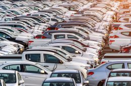 Row of new cars in port.